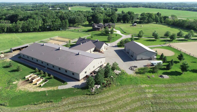 Aerial view with equine facility in front and home further back