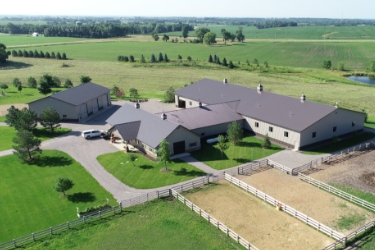 Aerial view of all buildings at equine facility.