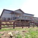 Post-frame home with view of large deck.
