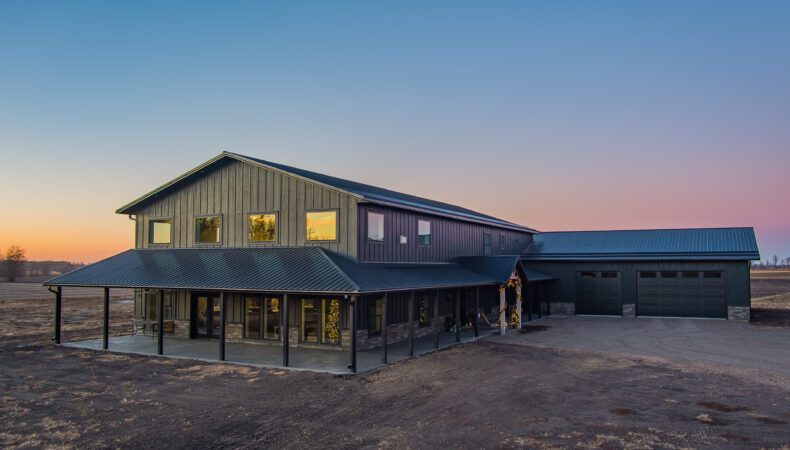 Full view of home from left side, highlighting large covered patio