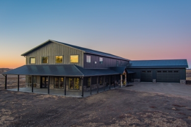 Angle of home from the residential side with sunset in background.