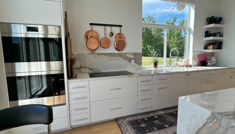 Bright kitchen with white cabinets.