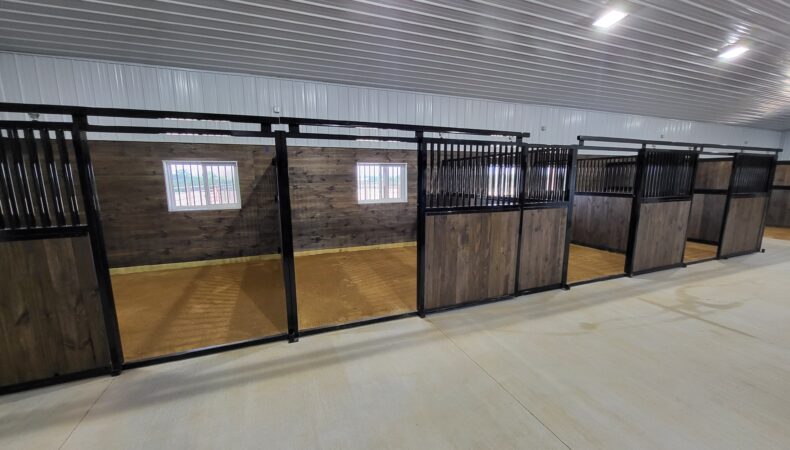 Line of horse stalls inside barn