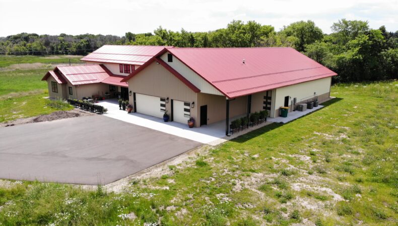 View of garage and parking spaces