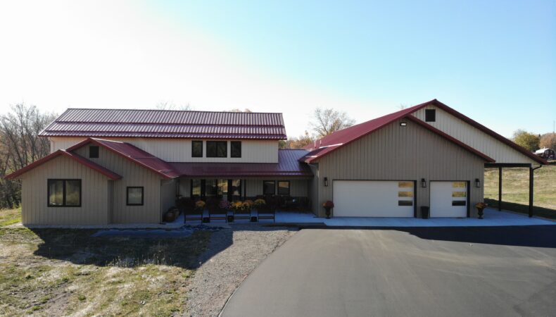 Front of beige home and red roof