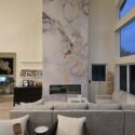 Tall marble fireplace featured wall