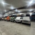 Garage space with several vehicles in storage