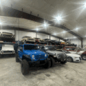 Garage space with several vehicles lined up