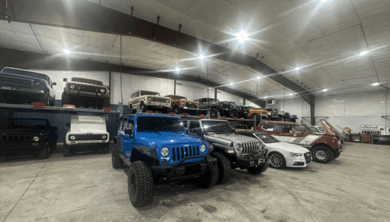 Garage space with several vehicles lined up