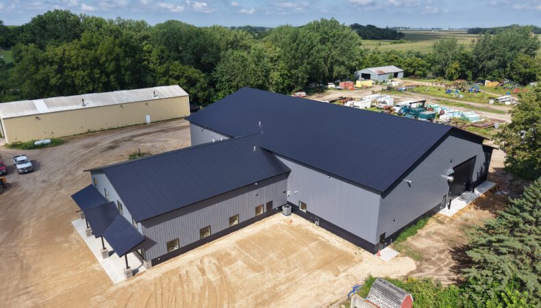 Aerial view of right side of building and parking area