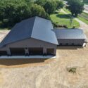 Aerial view of the left side of building and garage doors