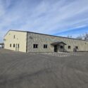 Front of building from large parking lot