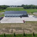 View of long garage space with several garage doors