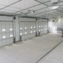 3 large garage doors from interior of truck station
