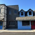 Left to right: Cream building, dark brick building, shorter blue building