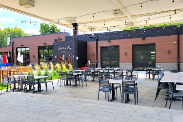 Restaurant with large outdoor sitting area.