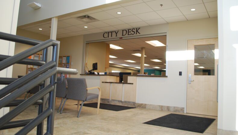 View of City Desk window from stairs.