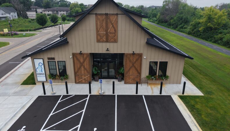 Front entrance of building that looks like a barn.