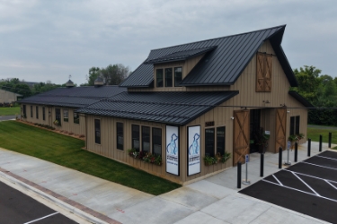 Exterior of vet clinic from left side of parking lot.
